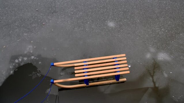 Wooden Sled on Thin Ice Lake, Danger of Drowning in Ice-Hole in Winter