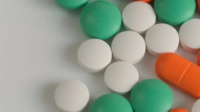 colorful pills - Opioid and prescription medication addiction epidemic or crisis - concept