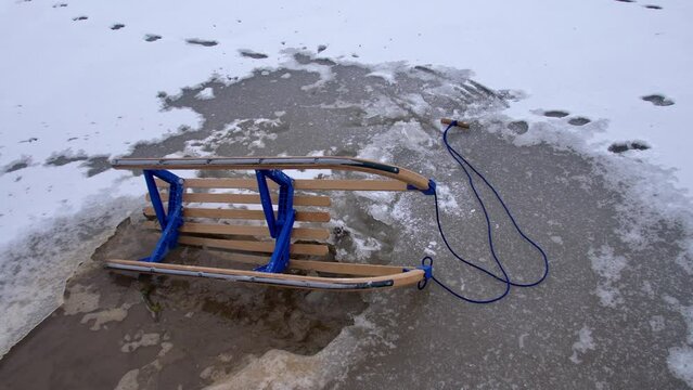Wooden Sled on Thin Ice Lake, Danger of Drowning in Ice-Hole in Winter