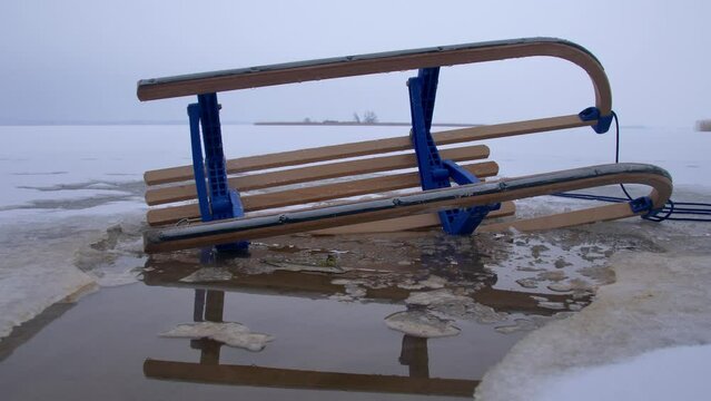Wooden Sled on Thin Ice Lake, Danger of Drowning in Ice-Hole in Winter