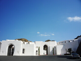 Beautiful Arabian osmanic architecture building facades palace in Muscat, Oman with blue sky,...
