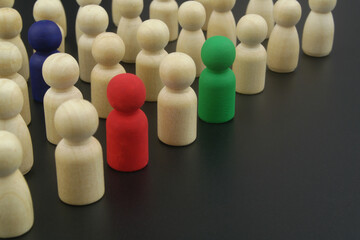 Different people figures, some figures colored, copy space for text. Uniqueness, individuality, and recruitment concept.