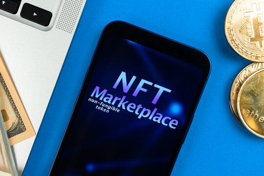 NFT cryptoart marketplace concept. Mobile phone for working with non-fungible token. Future of crypto currency, blockchain technology. Office table with laptop and ethereum coin, top view photo