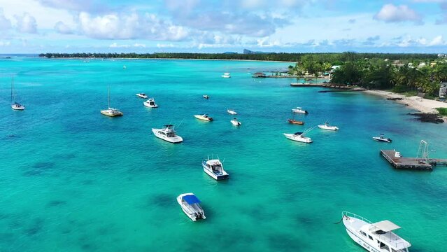 Aerial view, flight at beaches with luxury hotels with water sports and boats at Trou-aux-Biches Pamplemousses Region, Mauritius, Africa