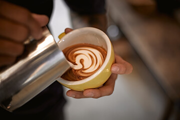 Hot latte art making by barista