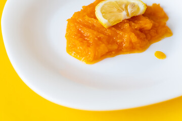 natural pumpkin porridge with lemon slice, healthy food, diet food