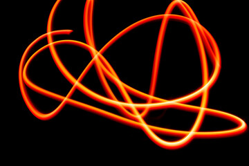 Close-Up Of Light Painting Against Black Background