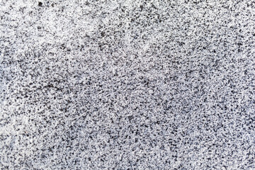 Black soot from the boiler room on white snow. Natural background. Snow mixed with coal soot, poor ecology. Environmental pollution 