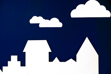 Silhouette of the city on a dark blue background.
