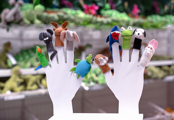 Finger toys in the form of various animals in a toy store.