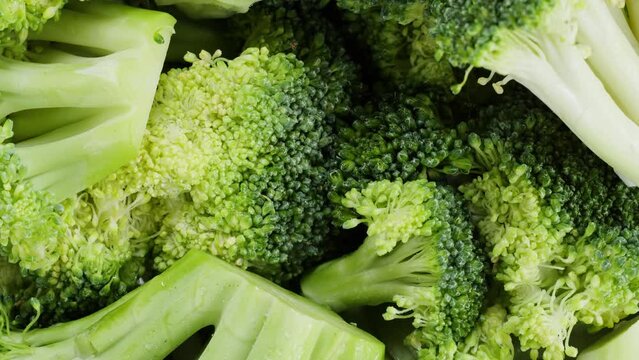 Broccoli top view, fresh green broccoli close-up, vitamins, raw food and vegetarian lifestyle concept.