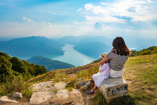 Mother and daughter looking at view of Lake Lugano, Balcone d'Italia, Italy