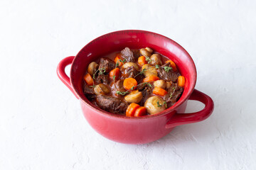 Beef bourguignon stew with carrots and mushrooms. French cuisine.