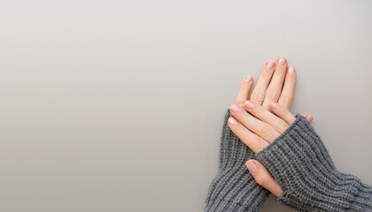 Beautiful female hands manicure background. Top view cosmetic banner with copy space.