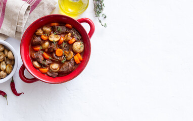 Beef bourguignon stew with carrots and mushrooms. French cuisine.