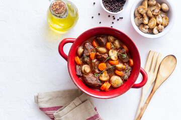 Beef bourguignon stew with carrots and mushrooms. French cuisine.