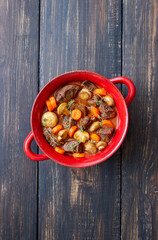 Beef bourguignon stew with carrots and mushrooms. French cuisine.