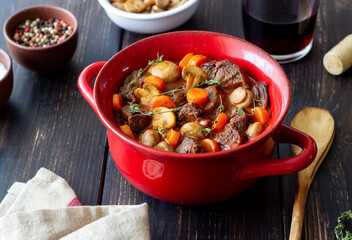 Beef bourguignon stew with carrots and mushrooms. French cuisine.