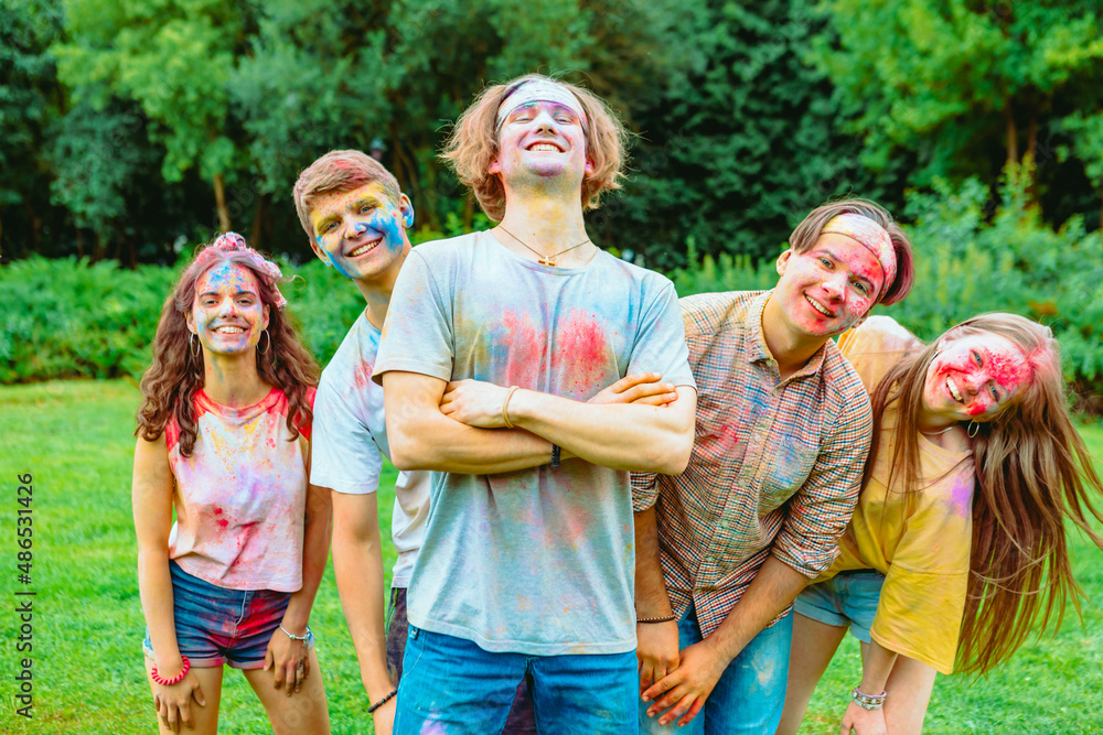 Wall mural young happy friends at holi fest