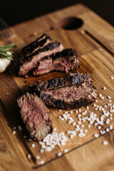 Salty steak of meat on the desk. Portion of meal