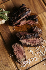 Salty steak of meat on the desk. Portion of meal