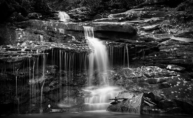 Rainbow Falls, Trough Creek State Park, Huntingdon County, Pennsylvania, USA. The falls are in the Raystown Lake Region near the town of Entriken. Taken in black and white in the autumn season.