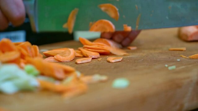 Slicing carrots and celery by a professional chef