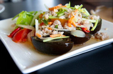 Thai food menu: Spicy Century Eggs Salad with minced pork and Thai herbs