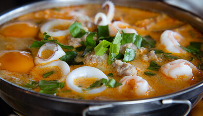Tom Yum prawn and Squid in Thai Style,spicy prawn soup in the hot pot