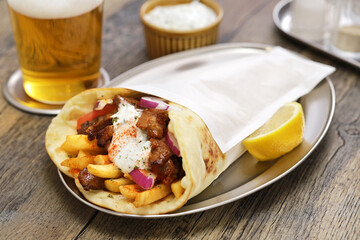 homemade pork meat gyros(pita wrap sandwich) with tzatziki(yogurt sauce), Greek food