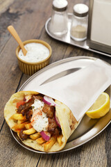 homemade pork meat gyros(pita wrap sandwich) with tzatziki(yogurt sauce), Greek food