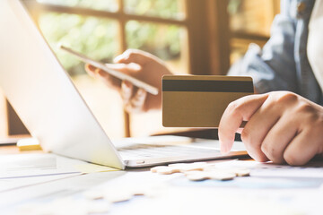 Close up hands young pretty woman working with documents graphs and Hand touching screen electronic tablet in the cafe at lunch,Technology communication concept