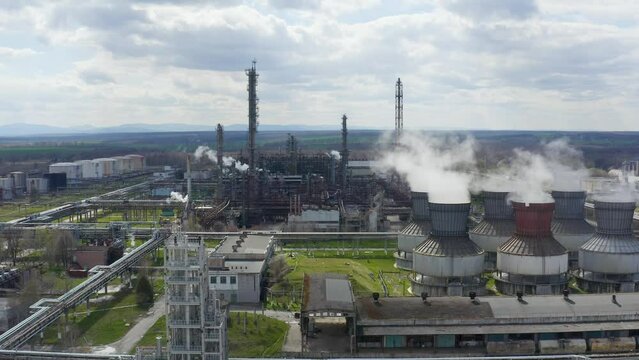 Industrial pipes of plant chimney smoke. chemical Plant ejects a cloud of steam. Environmental pollution. Chemical emissions into the atmosphere.