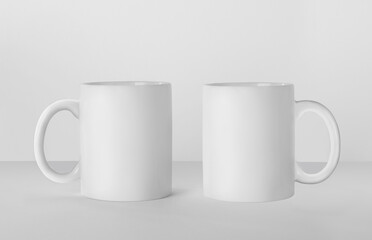 Blank ceramic mugs on white background. Mockup for design