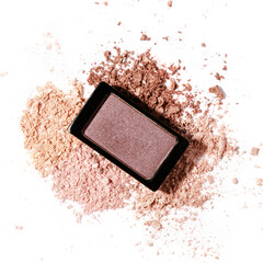 Beauty swatches. Scattered eye shadow isolated on a white background. macro