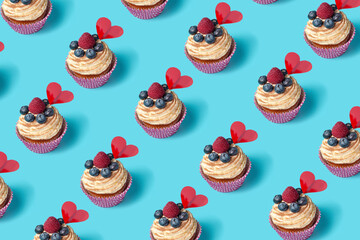 trendy seamless pattern of cupcake with berries on blue background, concept of St. Valentines Day