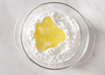 step of Cooking icing for cookies, powdered sugar with whites in a bowl, baking