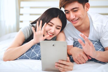 asian couple using tablet or computer start a business selling products online.