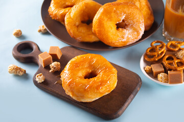 Homemade delicious donuts with caramel syrup sauce on the plate