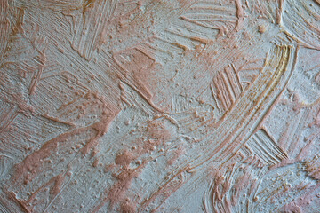 Stucco wall with gold paint