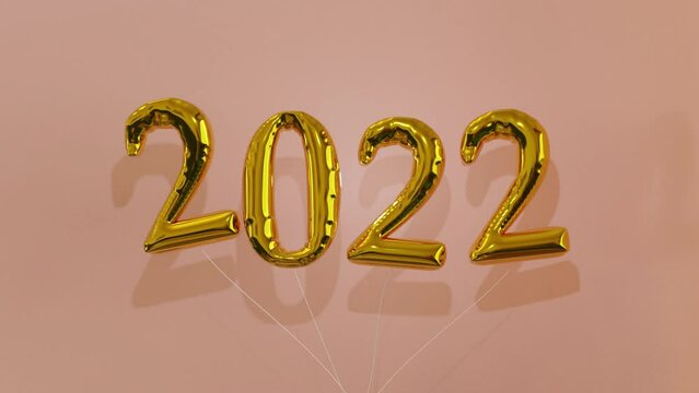 Gold 2022 foil balloons bob up and down