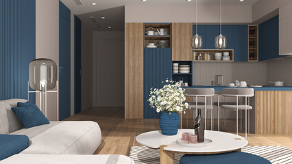 Cozy blue and wooden living room and kitchen in modern apartment, velvet sofa with table, kitchen with island and dining table, chairs. Carpet and appliances, interior design idea