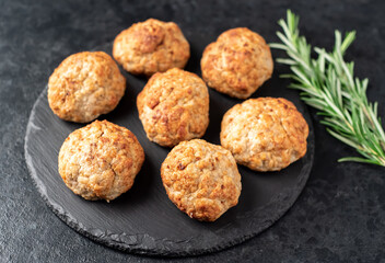 homemade fried cutlets on a stone background