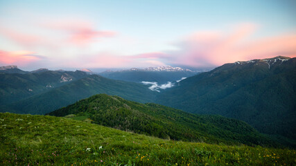 Fototapeta premium Landscape panorama of the mountains and forests in the dark. Long exposure at sunset - blue hour 