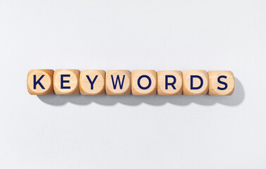 Keywords word on wooden blocks isolated on gray background