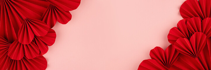 Romance Valentines day banner with passion red paper hearts as sideways border, frame on pastel...