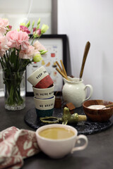 Coffee corner on the kitchen worktop, small glasses and a sugar bowl