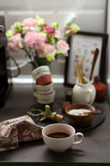 Coffee corner on the kitchen worktop, small glasses and a sugar bowl