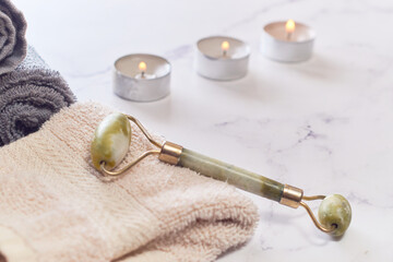 Face roller for anti age wrinkle treatment. Flat lay.
