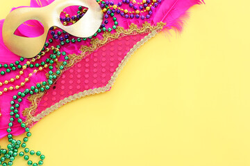 Holidays image of mardi gras and brazil masquarade carnival mask over yellow background. view from...